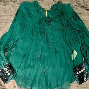 Free people beautiful sheer blouse with sequin cuff.  Xs